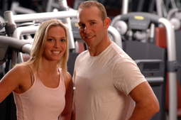 Photo of male and female personal fitness trainers in a gym location.