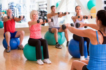 Photo of an Exercise Ball Fitness Workout Class in progress.