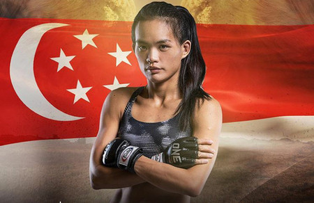 Image of Tiffany Teo in front of the national flag of Singapore.