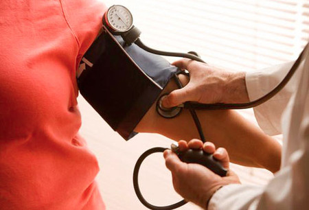 Image of a special populations fitness client having her blood pressure measured.